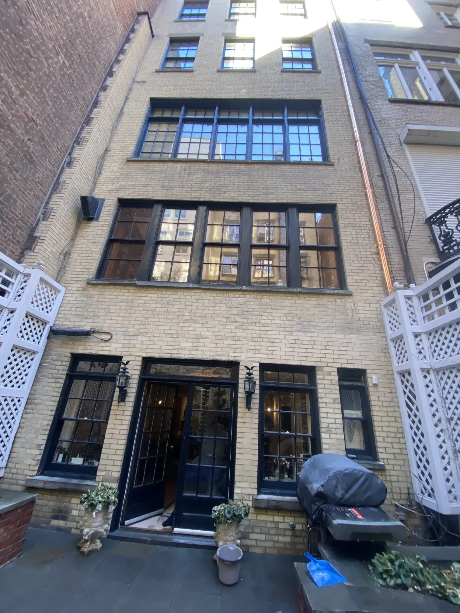Brick facade of an NYC townhouse after repointing and mortar replacement